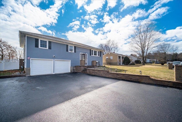 view of front of home with a garage and a front yard