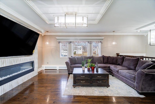 living room with ornamental molding, wood-type flooring, and a healthy amount of sunlight