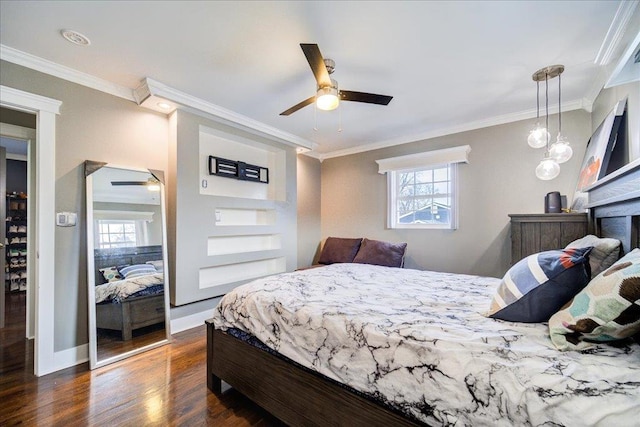 bedroom featuring ornamental molding, dark hardwood / wood-style flooring, and ceiling fan