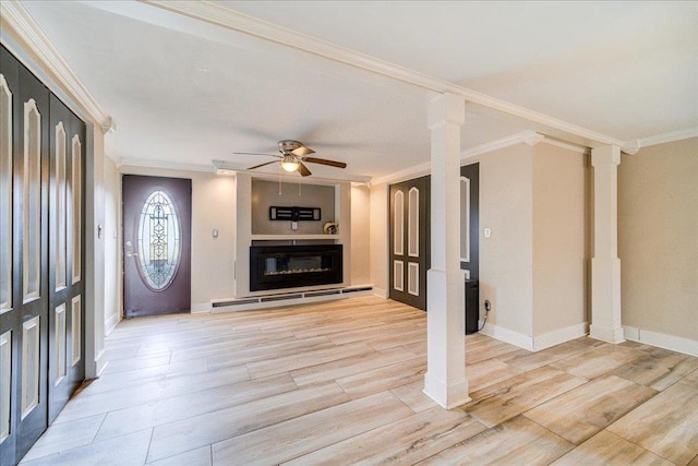 unfurnished living room with decorative columns, crown molding, ceiling fan, and light hardwood / wood-style flooring