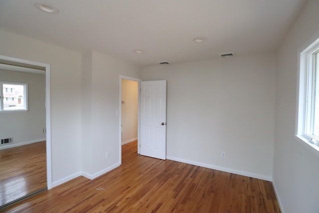 unfurnished bedroom featuring hardwood / wood-style flooring