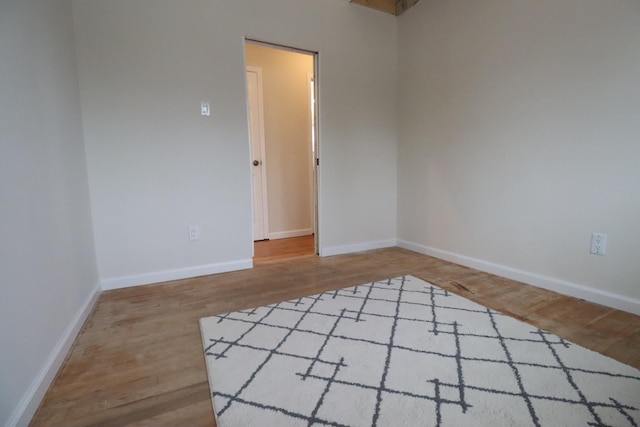 unfurnished room featuring hardwood / wood-style floors