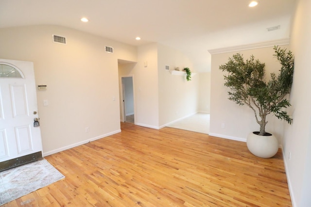 foyer entrance with light wood-type flooring