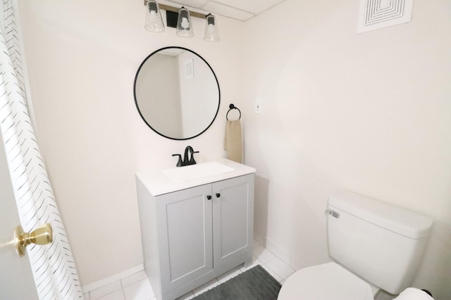 bathroom with vanity, tile patterned floors, and toilet