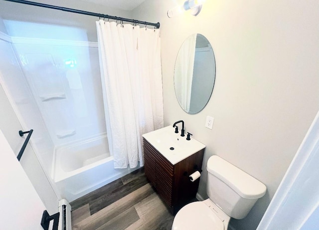 full bathroom featuring hardwood / wood-style floors, toilet, vanity, and shower / bath combo