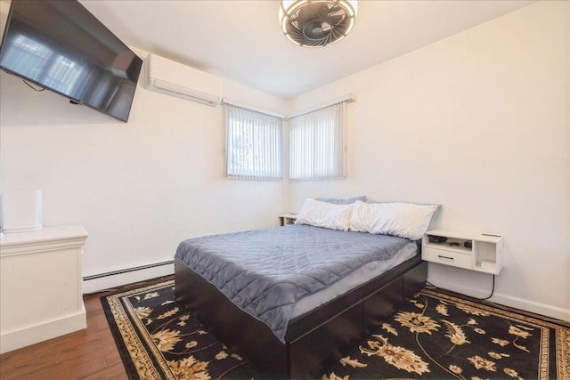 bedroom featuring dark wood-type flooring and a baseboard radiator