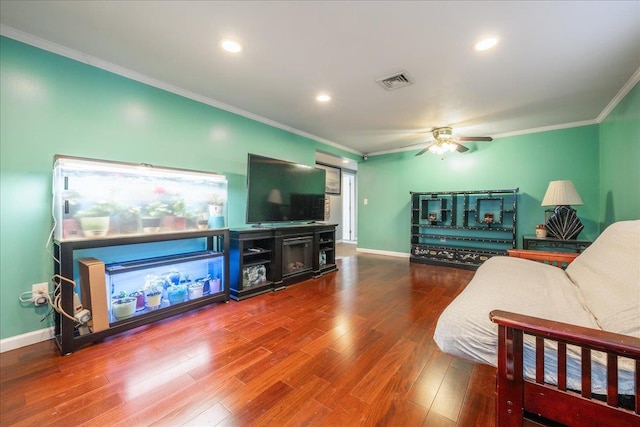 living room with ceiling fan, ornamental molding, and hardwood / wood-style floors