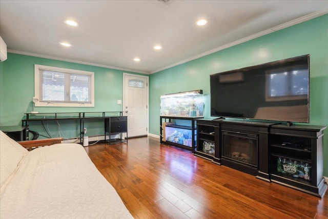 living room featuring dark wood-type flooring and crown molding