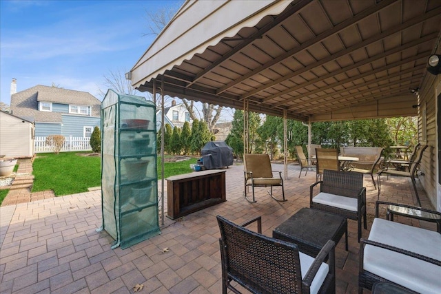 view of patio / terrace with an outdoor living space and a grill