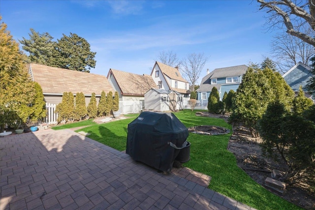 exterior space with a front lawn and a patio area