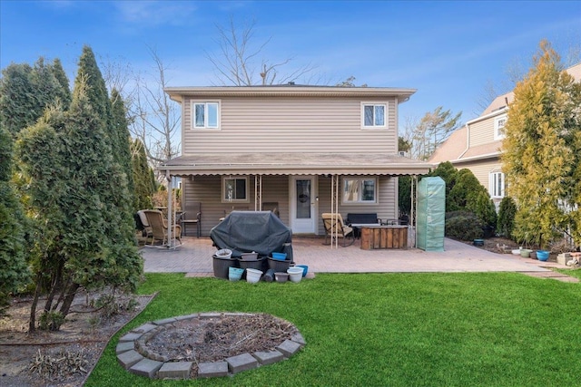 back of house featuring a patio area, an outdoor fire pit, a yard, and an outdoor bar