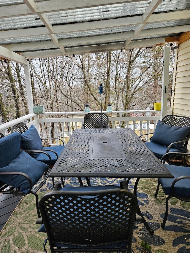 view of patio featuring a wooden deck and a pergola