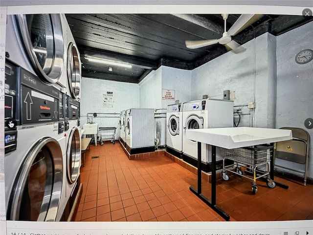 laundry room featuring stacked washer and dryer, washing machine and clothes dryer, and ceiling fan