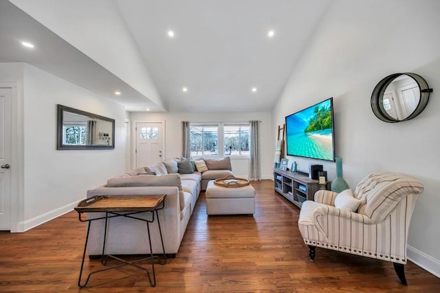 living room with dark hardwood / wood-style flooring and high vaulted ceiling