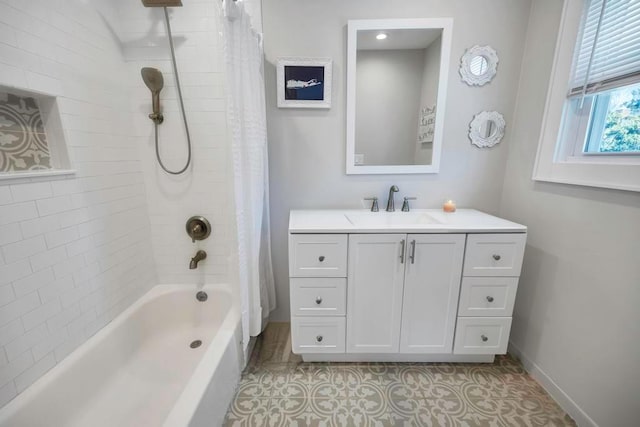 bathroom with shower / tub combo, vanity, and tile patterned floors