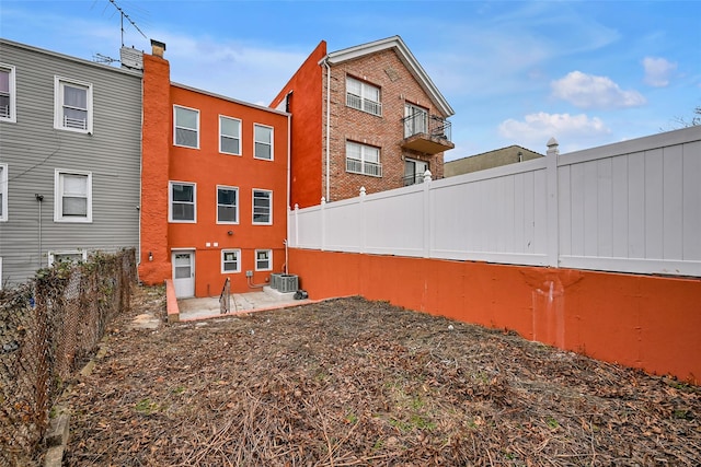 view of side of home featuring central AC and a patio