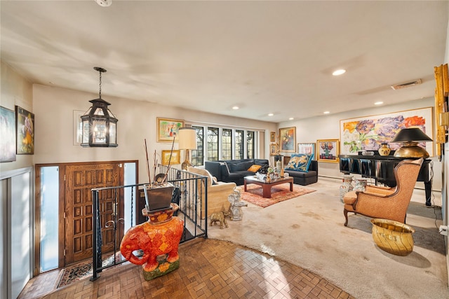 living room with an inviting chandelier