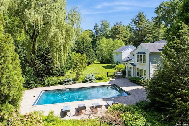 view of swimming pool featuring a patio area