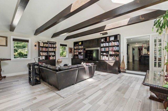 living room featuring light hardwood / wood-style floors and beamed ceiling