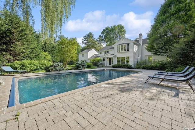 view of swimming pool with a patio