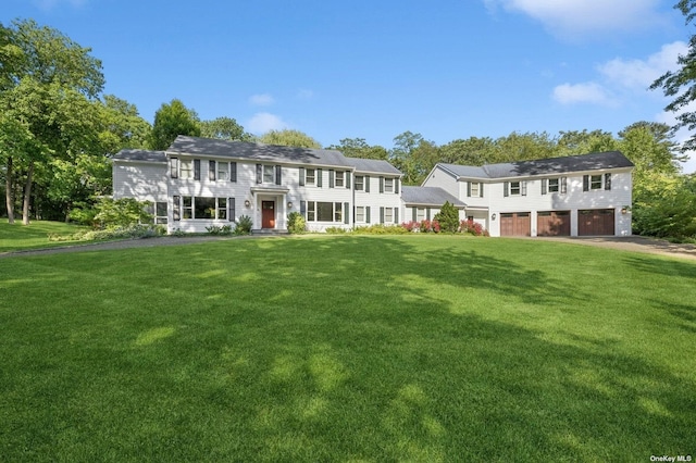 view of front of house featuring a front yard and driveway