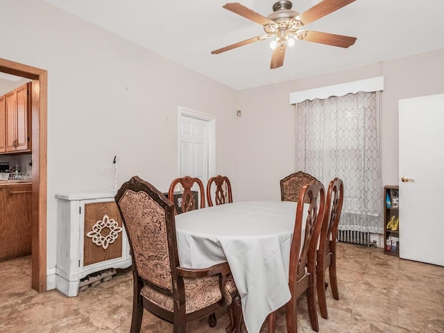 dining room featuring ceiling fan