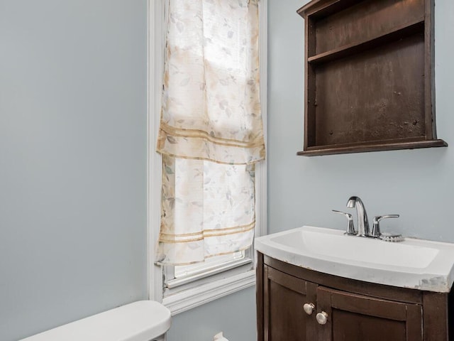 bathroom with vanity and toilet