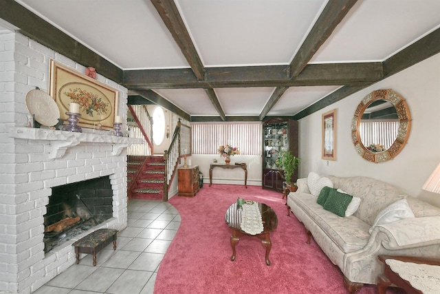 living room with a baseboard heating unit, a fireplace, light tile patterned flooring, and beamed ceiling