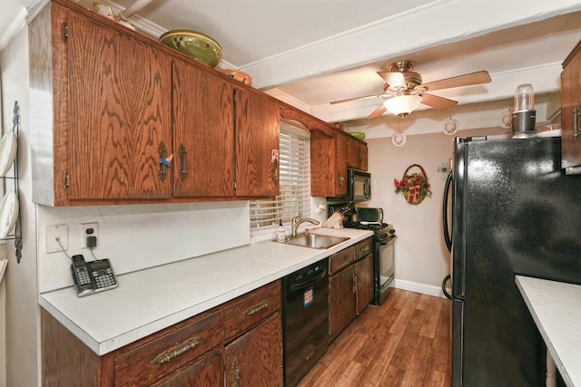 kitchen with ceiling fan, sink, hardwood / wood-style flooring, and black appliances