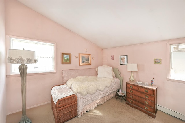 carpeted bedroom featuring a baseboard radiator and lofted ceiling