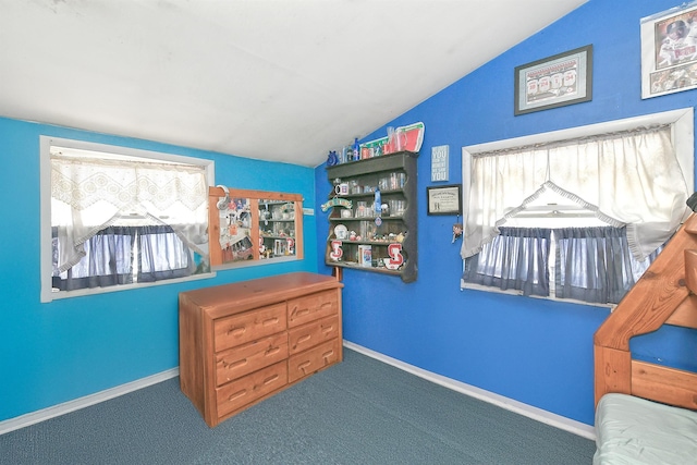 bedroom featuring carpet and vaulted ceiling