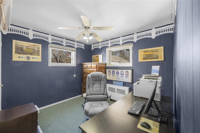 carpeted office space featuring ceiling fan