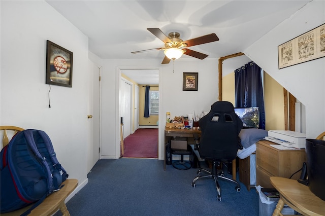 home office with carpet, a baseboard heating unit, and ceiling fan