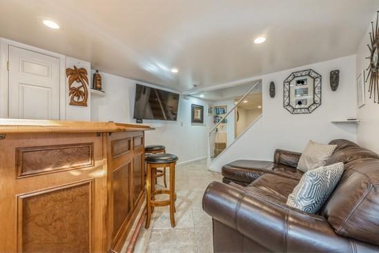 living room featuring indoor bar