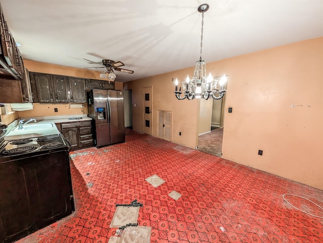 kitchen with dark brown cabinets, decorative light fixtures, ceiling fan with notable chandelier, black electric range, and stainless steel fridge