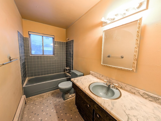 full bathroom featuring a baseboard radiator, tile patterned floors, tiled shower / bath, toilet, and vanity