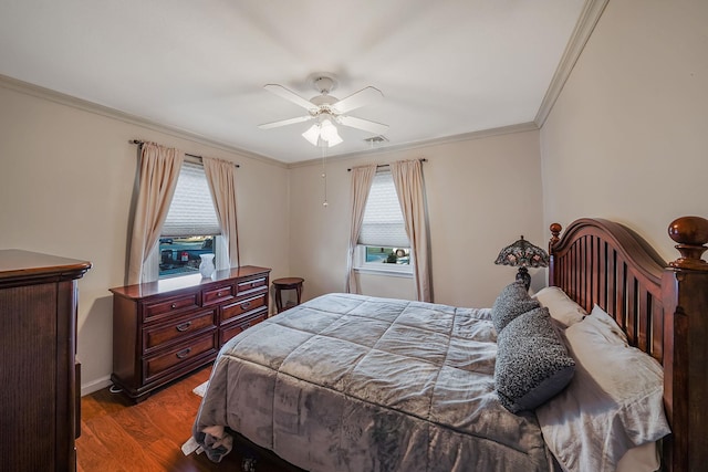 bedroom featuring ceiling fan, multiple windows, hardwood / wood-style flooring, and ornamental molding