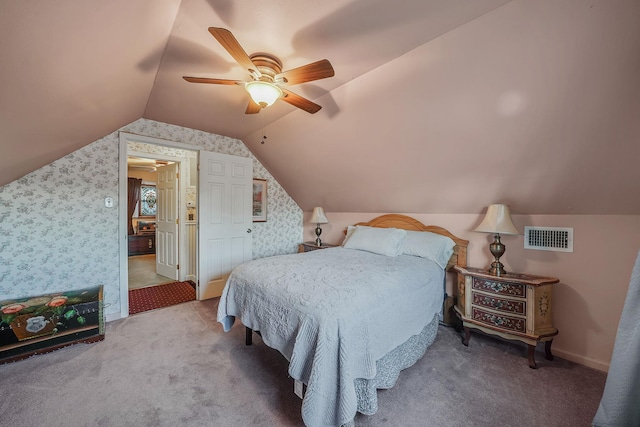 carpeted bedroom featuring ceiling fan and vaulted ceiling