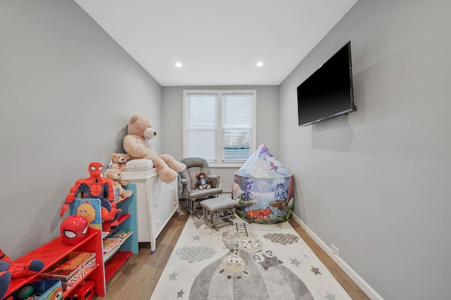 game room featuring hardwood / wood-style floors