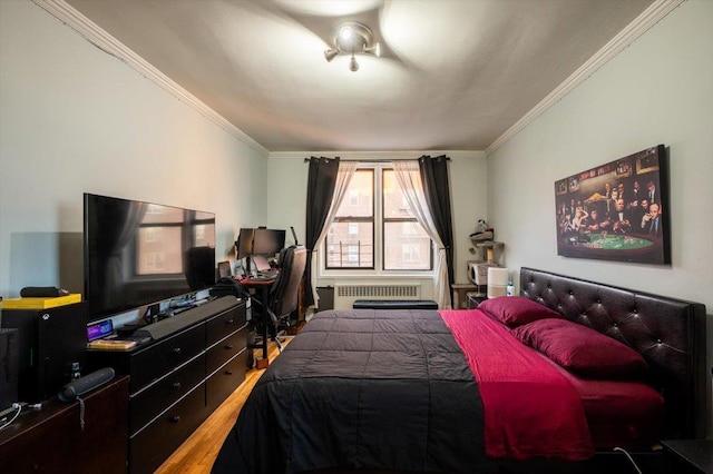 bedroom featuring radiator heating unit and crown molding