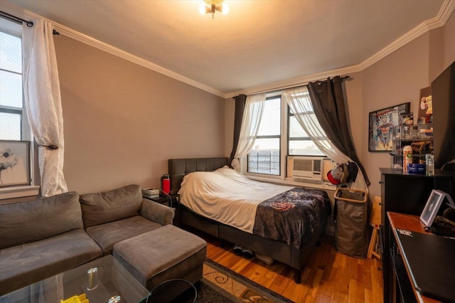 bedroom featuring hardwood / wood-style floors and ornamental molding