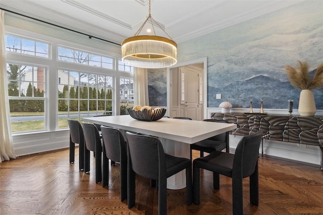 dining room with dark parquet flooring and ornamental molding