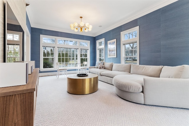 carpeted living room featuring crown molding and a chandelier