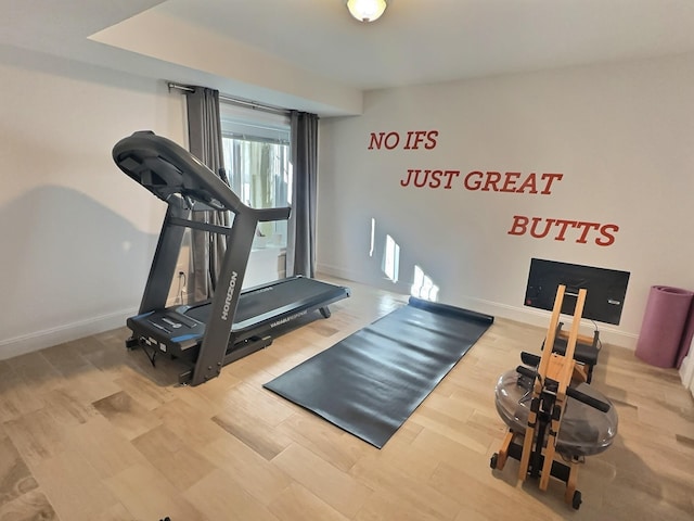 workout area featuring hardwood / wood-style floors