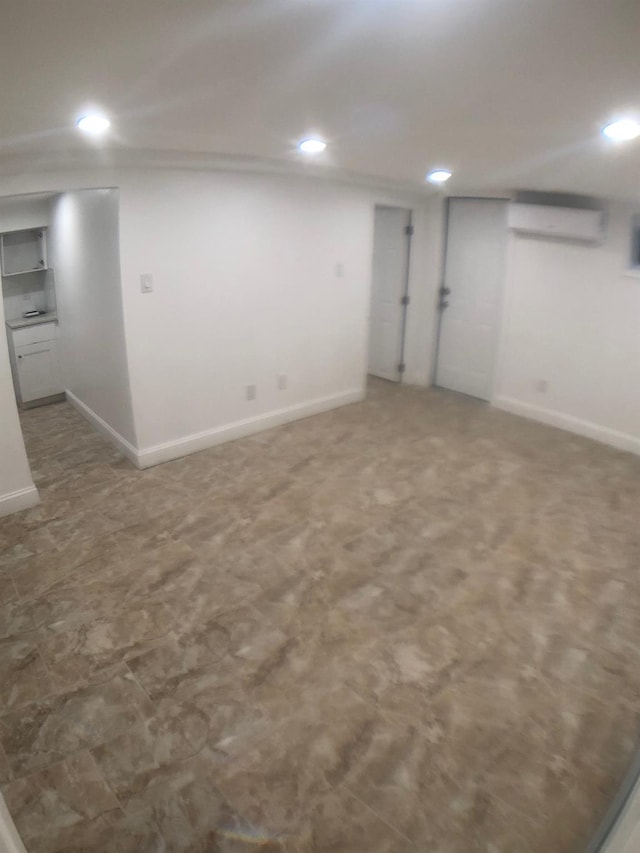 basement with an AC wall unit