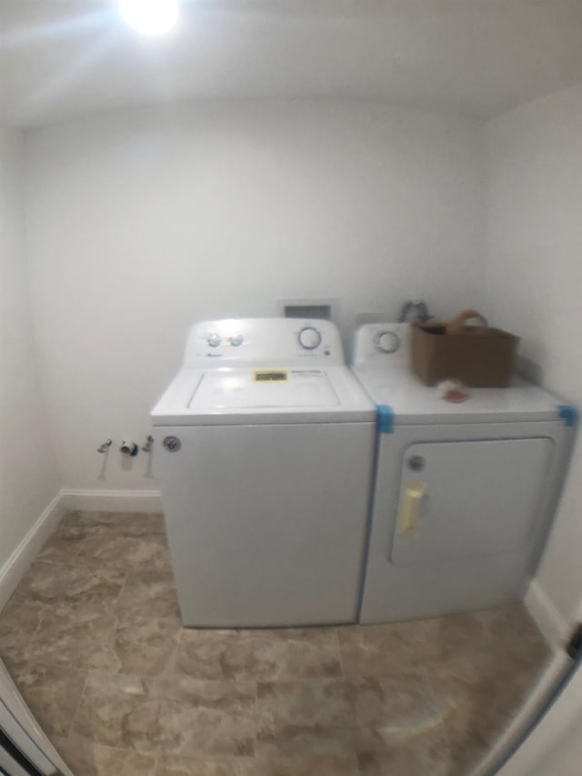 clothes washing area with independent washer and dryer