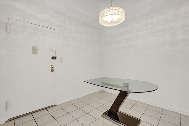 unfurnished dining area featuring light tile patterned floors