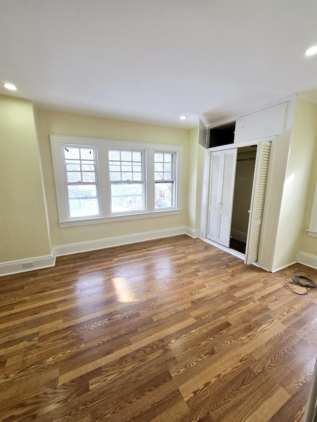 spare room featuring dark wood-type flooring