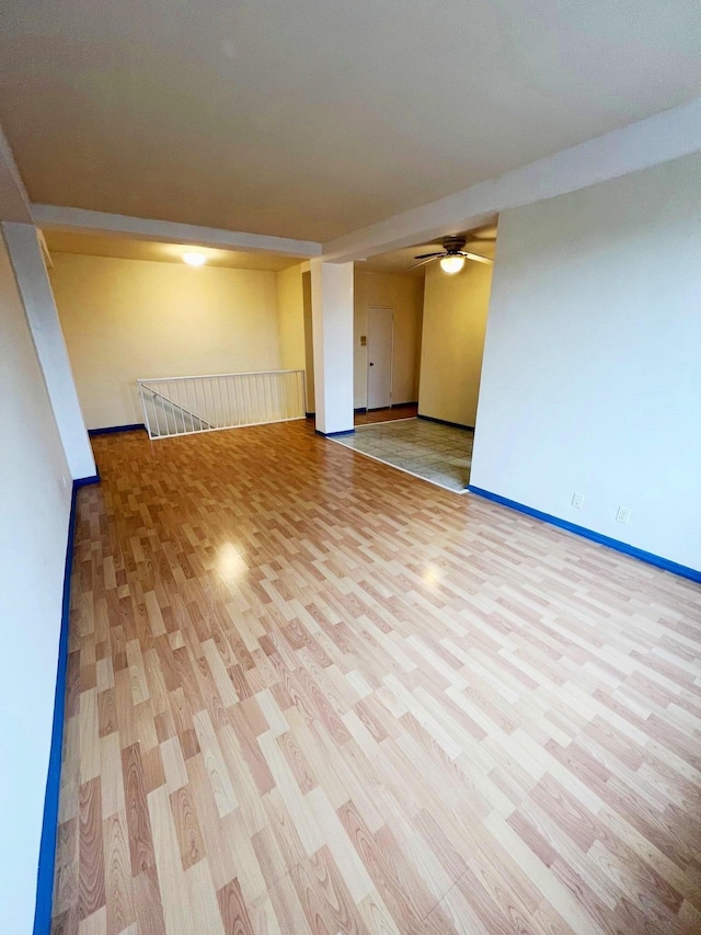 empty room featuring light hardwood / wood-style floors and ceiling fan