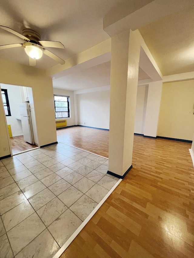 bonus room featuring ceiling fan and light wood-type flooring